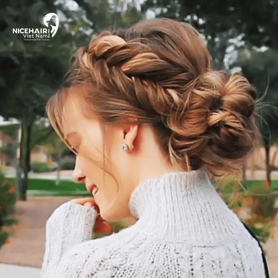 Side French braid with a messy bun